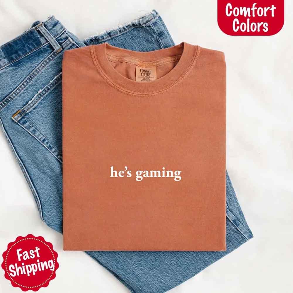 He’s Gaming – Funny Relationship Comfort Color Shirt for Her