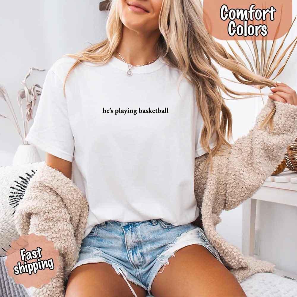 He’s Playing Basketball – Funny Sports Girlfriend Comfort Color Shirt for Women