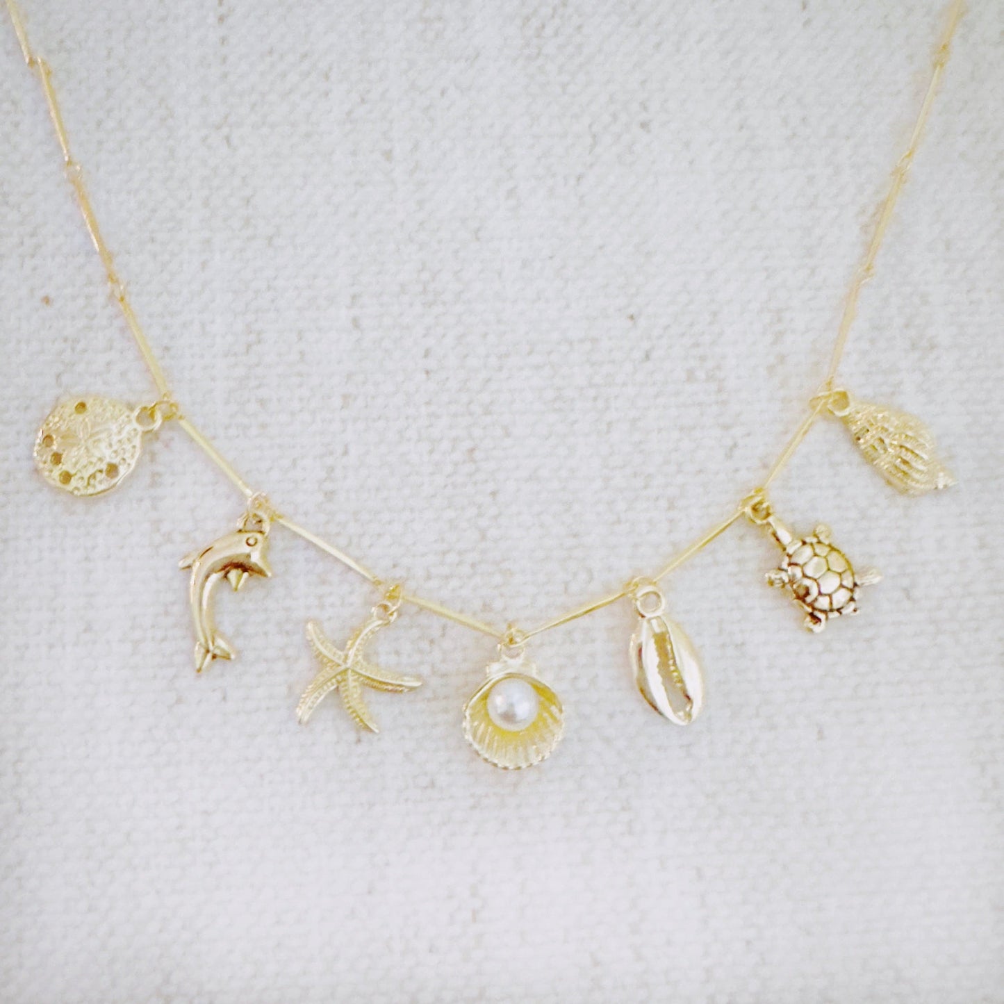 Golden Sea Charm Necklace – Shell, Dolphin & Starfish