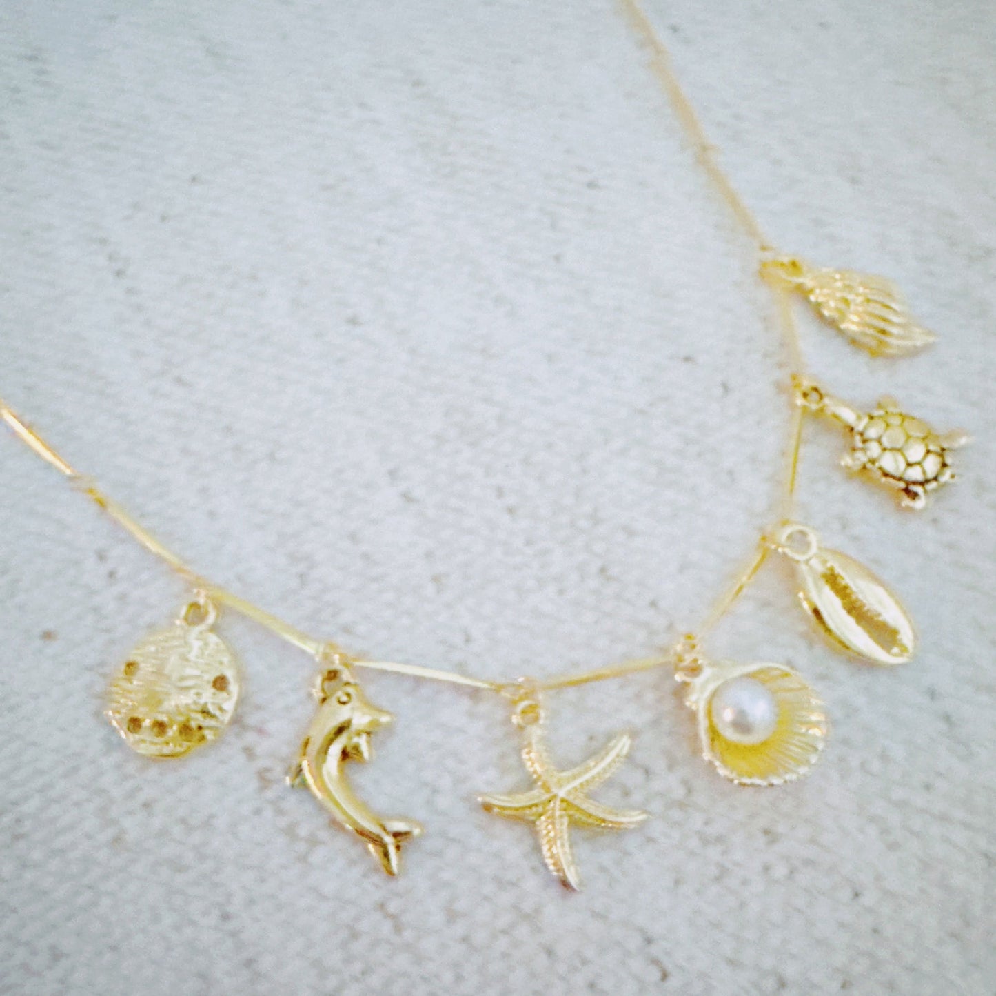 Golden Sea Charm Necklace – Shell, Dolphin & Starfish