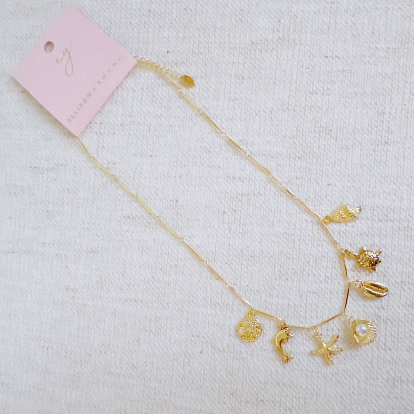 Golden Sea Charm Necklace – Shell, Dolphin & Starfish