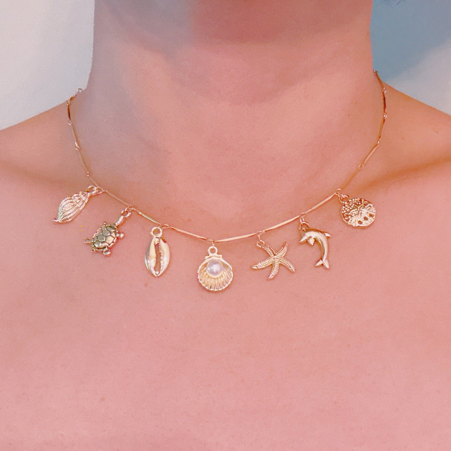 Golden Sea Charm Necklace – Shell, Dolphin & Starfish